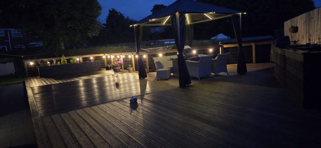 Garden and decking lighting at night